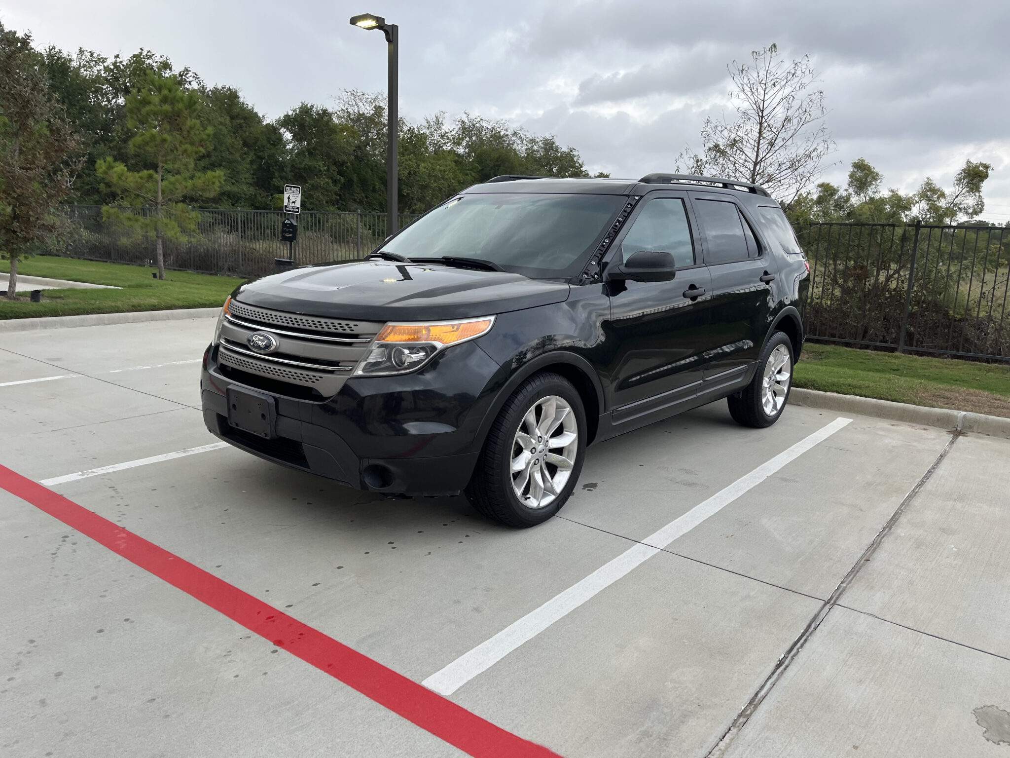Black Ford Explorer on a parking lot, ready for mobile auto care service